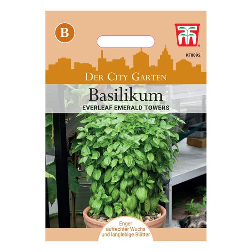 Ein Thompson&Morgan Basilikum 'Everleaf Emerald Towers' Paket zeigt eine üppige Basilikumpflanze, Motive von Stadtlandschaften und deutsche Informationen über "Langanhaltende Ernte und Genoveser Geschmack".