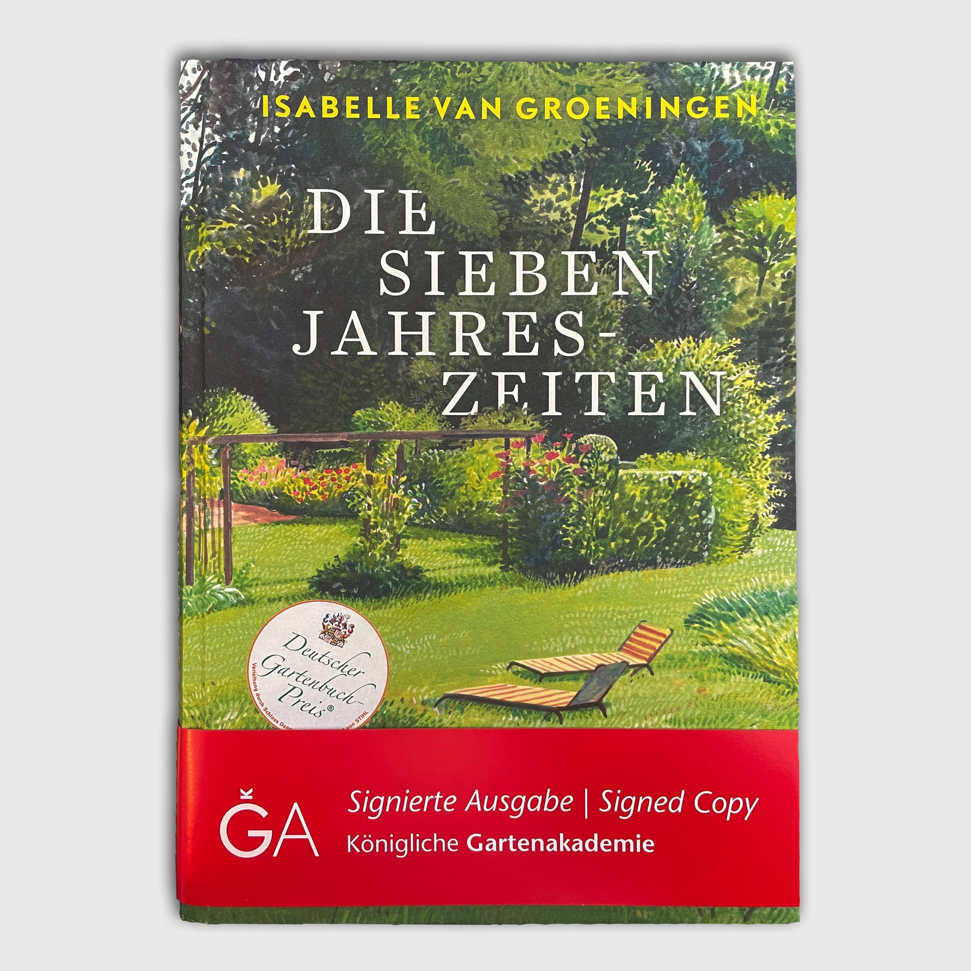 Das Buch - Die Sieben Jahreszeiten der Königlichen Gartenakademie zeigt auf dem Einband eine Gartenillustration - ideal für Gärtnern-Fans. Auf einem roten Banner steht Signierte Ausgabe | Signed Copy.