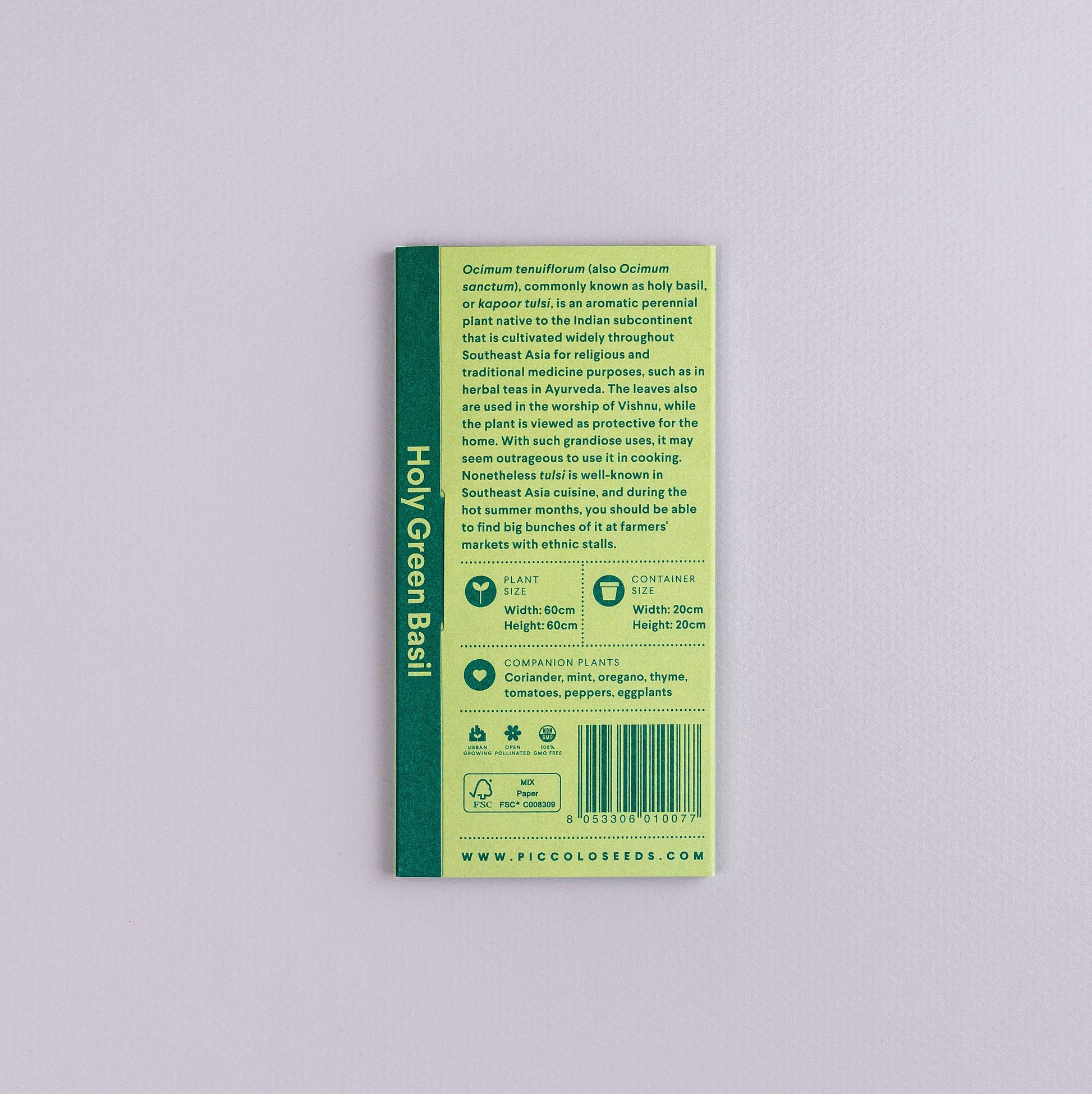 Ein grünes Päckchen von Piccolo Seeds mit der Aufschrift „Basil Heiliges Grün“ auf hellviolettem Hintergrund. Es enthält Tipps zum Anbau, Verwendungsmöglichkeiten, Begleitpflanzen und Informationen zu Ocimum tenuiflorum (Tulsi). Auch bekannt als Heiliges Basilikum.
