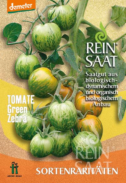 Nahaufnahme der Tomatenpflanze „Green Zebra“ von Reinsaat mit grün-gelb gestreiften Tomaten, deutschem Text über Bio-Saatgut, smaragdgrünem Fruchtfleisch und mildem Geschmack vor einem gelb-orangen dekorativen Hintergrund.