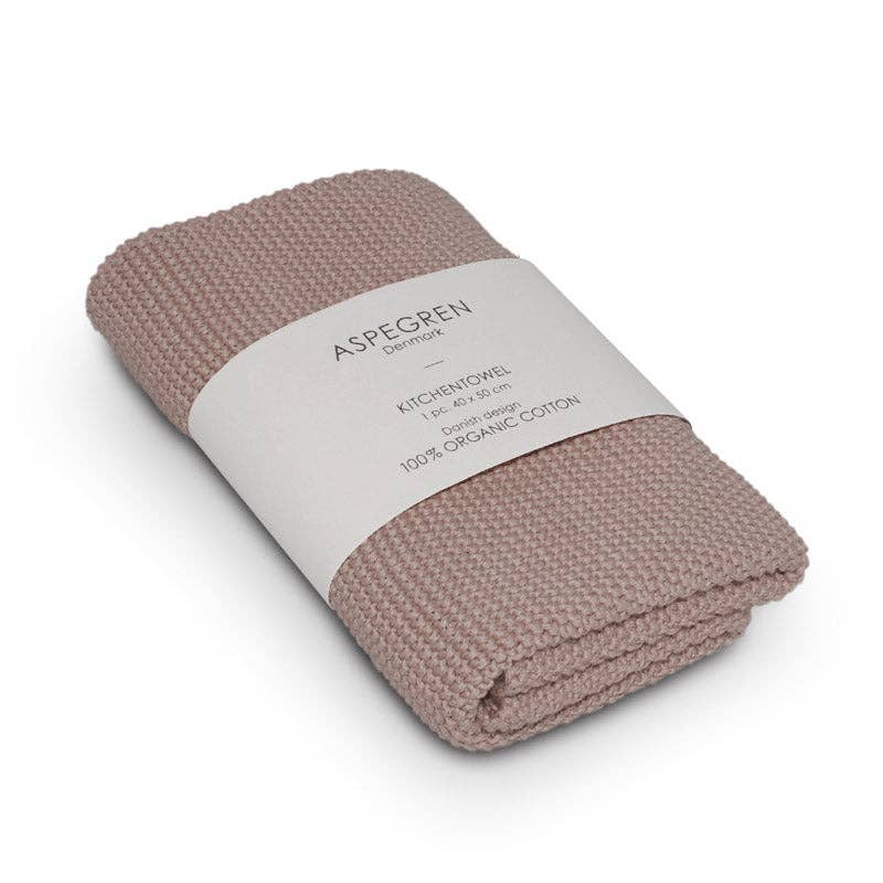 Ein gefaltetes, strukturiertes Küchentuch in hellem Malve (Aspegren Denmark – Küchentuch – Solid) aus 100 % Baumwolle, verpackt in einem weißen Etikett mit der Marke Aspegren Denmark und Produktdetails.