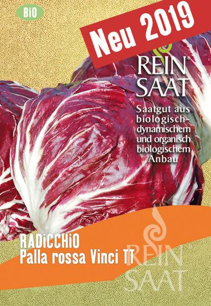 Abgebildet ist eine Packung Bio-Saatgut von Reinsaat mit zwei Köpfen Radicchio „Palla rossa Vinci TT“ von ReinSaat, einer Sorte von Cichorium intybus, die sich ideal für den Frischverzehr eignet und mit der Aufschrift „Neu 2019“ und deutschen Produktdetails versehen ist.