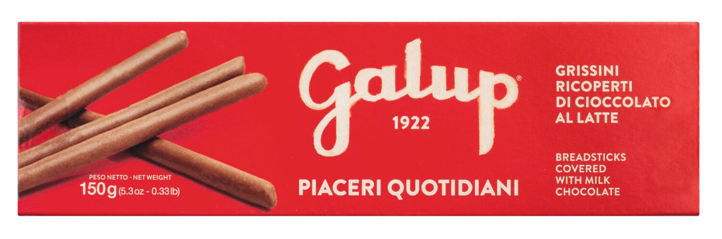 Eine rote Schachtel Galup Grissini mit Milchschokolade - knusprig, edel, italienisch zeigt schokoladenüberzogene Brotstangen auf der Verpackung mit italienischem und englischem Text.