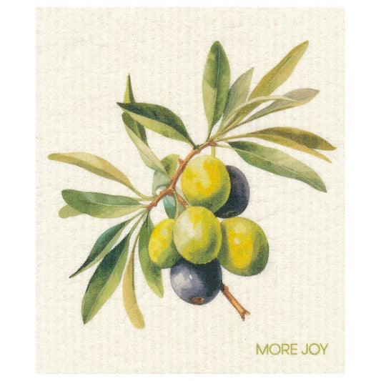 Die Illustration eines Zweiges mit grünen und schwarzen Oliven und Blättern ziert das More Joy - Schwammtuch Olives von More Joy, auf einem hellen, strukturierten Hintergrund mit "MORE JOY" in Gold unten rechts, gedruckt auf umweltfreundlichem Geschirrtuchmaterial.