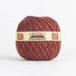 Ein rot-brauner Ball von Nutscene Twines Ltd - Farbenfrohe Jute-Schnurbälle aus der Heritage Twine-Reihe trägt ein beiges Etikett mit Union Jack Flaggen und "NUTSCENE THE IDEAL GARDEN TWINE"; biologisch abbaubar und vegan.