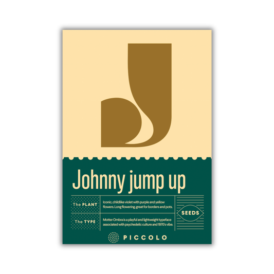 Eine Samenpackung mit einem großen J und „Johnny Spring Hoch“ trägt das Logo von Piccolo Seeds. Der untere Abschnitt beschreibt Viola cornuta als verspielte, leichte Blume mit violetten und gelben Blüten.