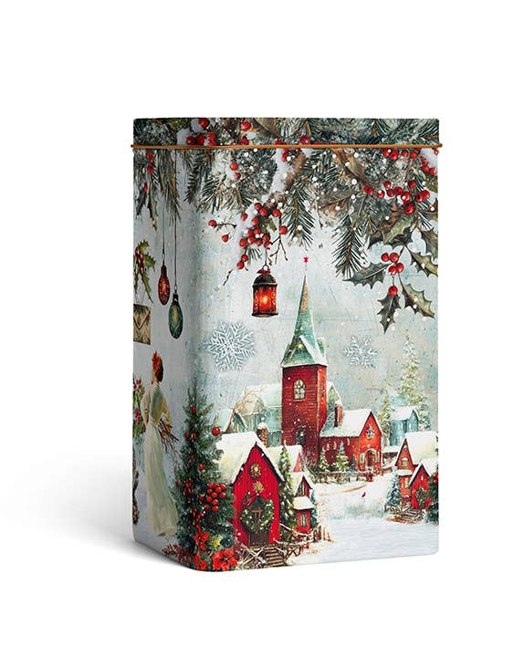 Die Lady Joseph Metallgeschenkbox zu Weihnachten zeigt ein festliches Winterdorf mit roten Häusern, Kirche und verschneiten Dächern - ideal als Geschenkbox für gemischte Kekse der Marke Lady Joseph.