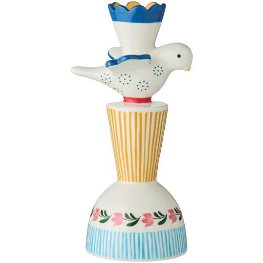 Der Kerzenhalter aus Keramik | farbig mit Vogel Gelb von IB Laursen ist ein farbenfroher vogelförmiger Kerzenhalter aus Keramik mit gelben Streifen, blauen Muscheln, rosa Blüten und grünen Blättern. Er fasst eine 2,2 cm große Kerze und steht auf einem runden, ausgestellten Sockel.