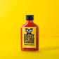 Die 100-ml-Flasche Crazy Bastard Sauce - Habanero & Tomatillo von CBS Foods GmbH hat ein gelbes Etikett mit schwarzem Text und illustrierten Augen auf leuchtend gelbem Hintergrund - ideal für Fans von scharfer Soße.