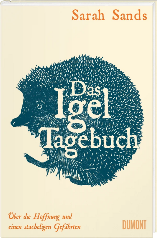 Buchumschlag von Das Igel-Tagebuch des Dumont Verlags, mit einer dunkelblauen Igel-Illustration auf hellem Hintergrund. Der Titel erscheint im Inneren des Igels, mit orangefarbenen Textakzenten und den Themen Winterschlaf und Memoiren.