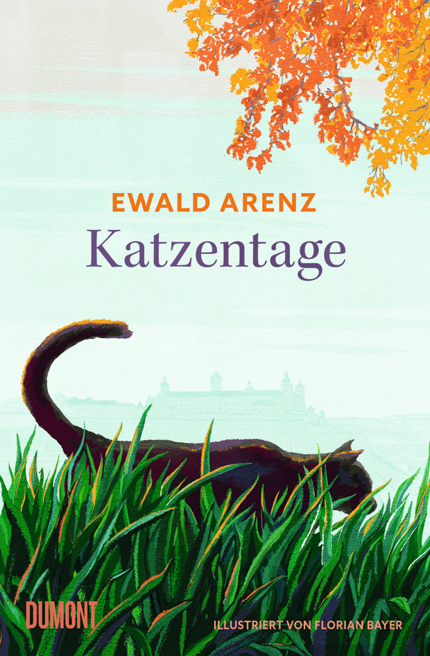 Eine schwarze Katze spaziert durch hohes Gras unter einem orangefarbenen Baum in Würzburg, in der Ferne ist die Silhouette einer Burg zu sehen. Der Buchtitel lautet "Katzentage" vom Dumont Verlag.