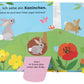Das bunte Pappbilderbuch "Natur-Entdeckerbuch: Da! Ein Fuchs" vom DK Verlag zeigt Waldtiere mit deutschen Sprechblasen und interaktiven Klappen, um spielerisch ihre Aktivitäten auf einer blumenreichen Wiese zu entdecken.