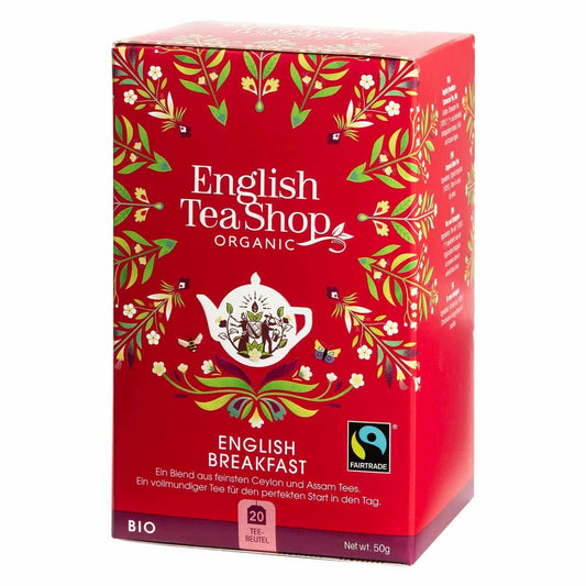 Eine rote Schachtel English Tea Shop – English Breakfast, BIO Fairtrade, 20 Teebeutel zeigt Blumenmuster, eine weiße Teekannengrafik und Zertifizierungslogos – perfekt für eine genussvolle Teezeit mit diesem aromatischen Klassiker.