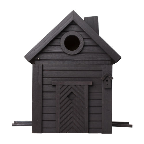 Der Wildlife Garden Nistkasten & Futterhaus in Carbon Black ist eine stilvolle Kombination aus Vogelhaus und Futterhaus, die wie ein kleines Haus geformt ist, mit einem runden oberen Eingang, dekorativen Türelementen und einem angebrachten Mini-Nistkasten auf der rechten Seite.