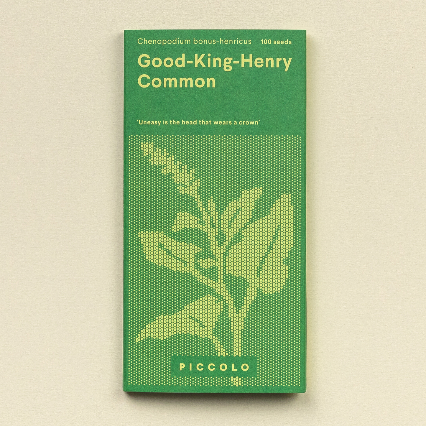 Eine grüne Piccolo Seeds Packung mit der Aufschrift "Der gute König Henry Common" mit einer gelben botanischen Illustration, dem lateinischen Namen "Chenopodium bonus-henricus", "100 Samen" und auch als wilder Spinat oder Good King Henry bezeichnet. Marke: Piccolo Seeds.