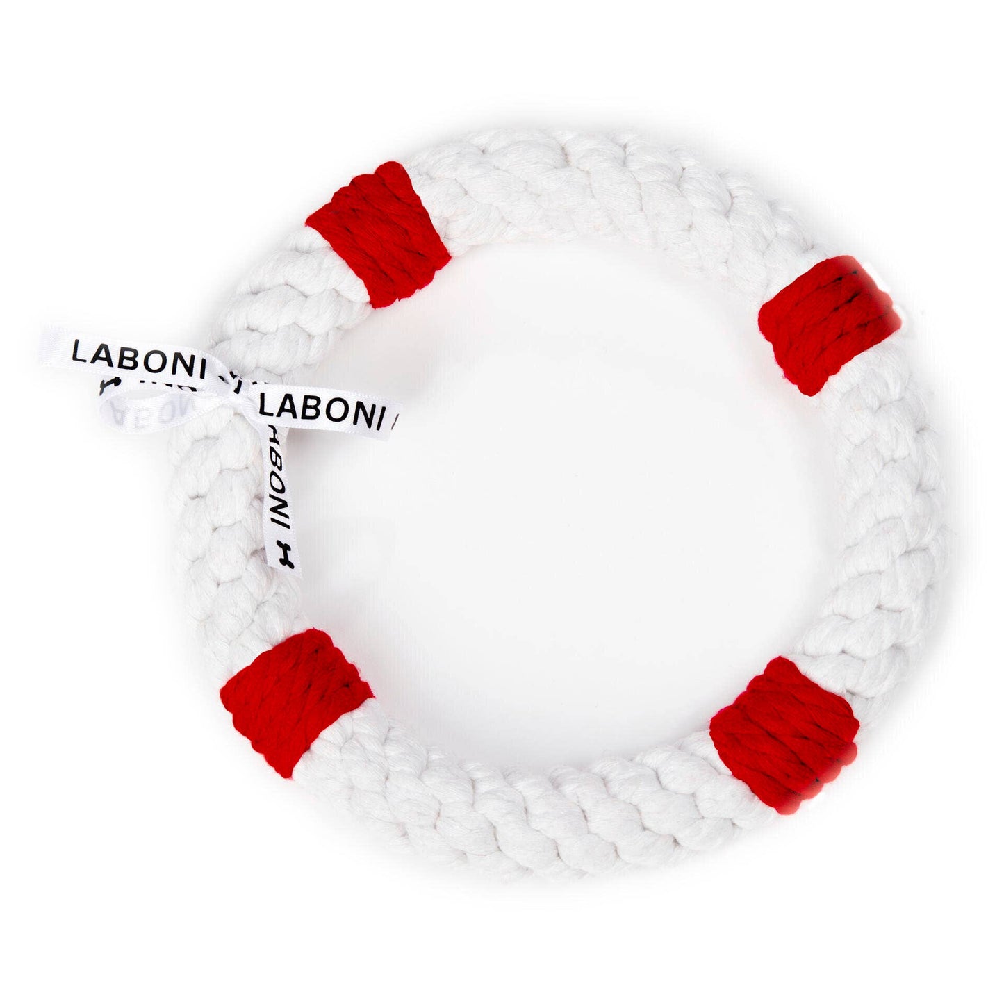 Der Rita Rettungsring von LABONI ist ein weißer, geflochtener Baumwollring mit vier roten Kordelabschnitten und einem LABONI TOYS Anhänger - ideal für die Zahnpflege Hund und stundenlangen Spielspaß.