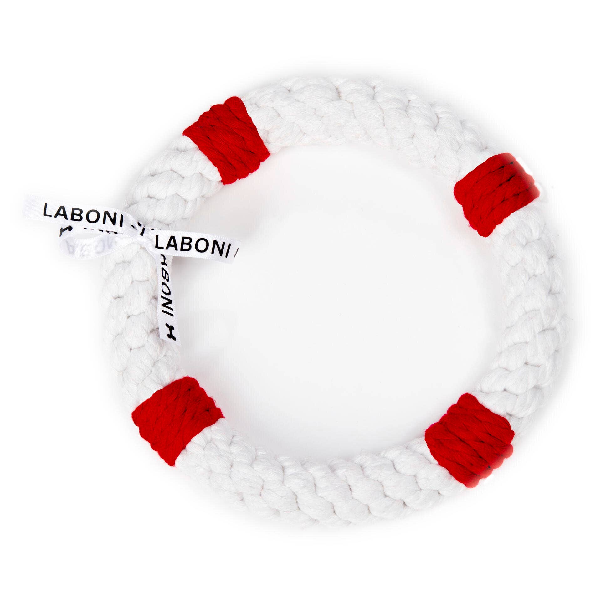Der Rita Rettungsring von LABONI ist ein weißer, geflochtener Baumwollring mit vier roten Kordelabschnitten und einem LABONI TOYS Anhänger - ideal für die Zahnpflege Hund und stundenlangen Spielspaß.