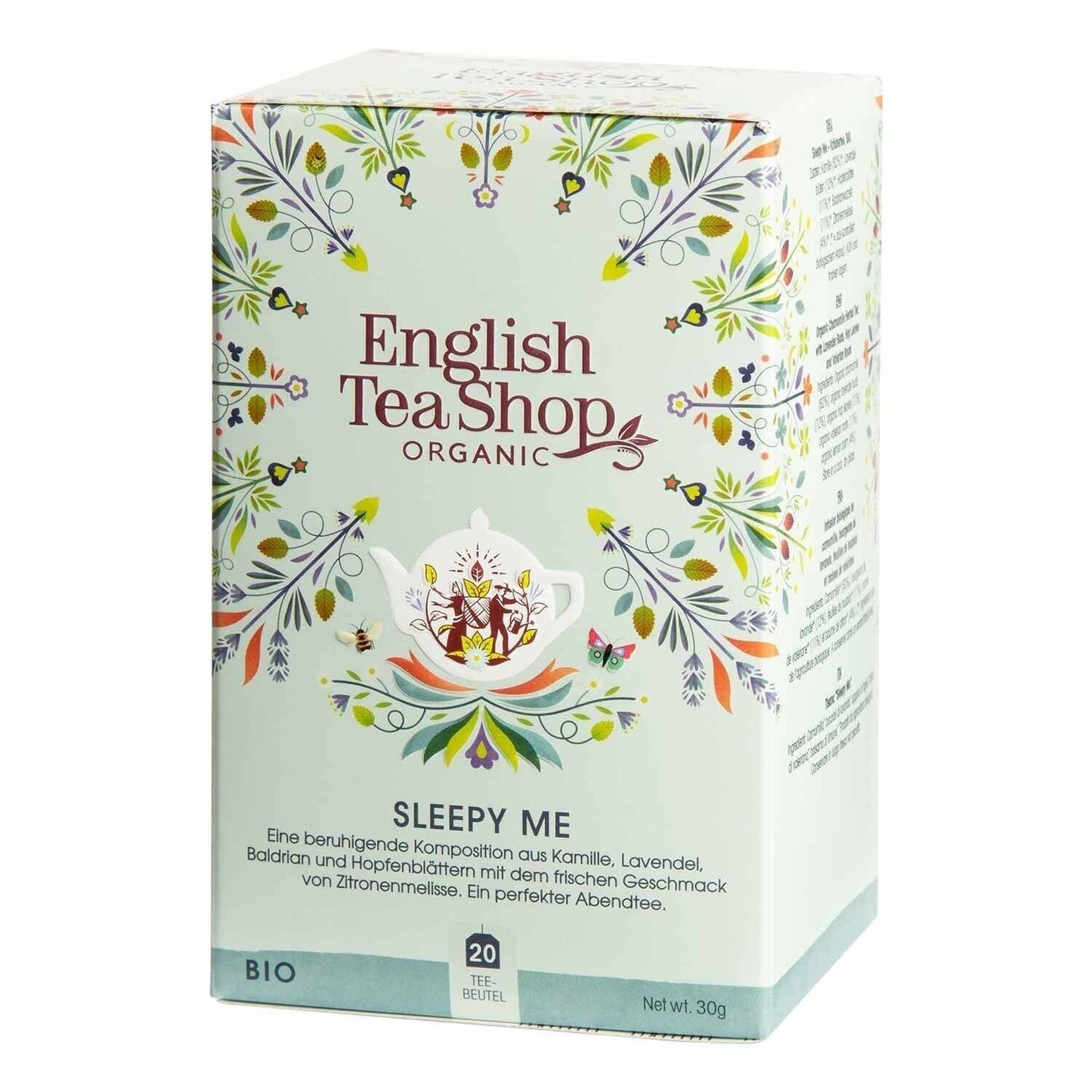 Eine Schachtel English Tea Shop - Sleepy Me, BIO Wellness-Tee (20 Teebeutel) mit Blumen- und Teetassendesign. Diese beruhigende Mischung enthält Kamille, Lavendel, Zitronenmelisse und weitere entspannende Kräuter.