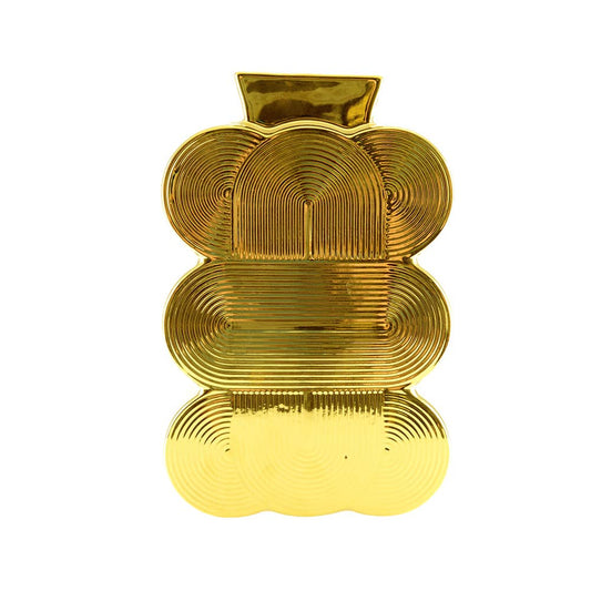 Die AULICA BRILLANTGOLDVASE (16,5 x 7 x 25 cm) verfügt über ein glänzendes Goldfinish, ein geometrisch abstraktes Design mit geschichteten Formen und konzentrischen Rillen sowie eine kleine rechteckige Öffnung, die ihr einen avantgardistischen Look verleihen.