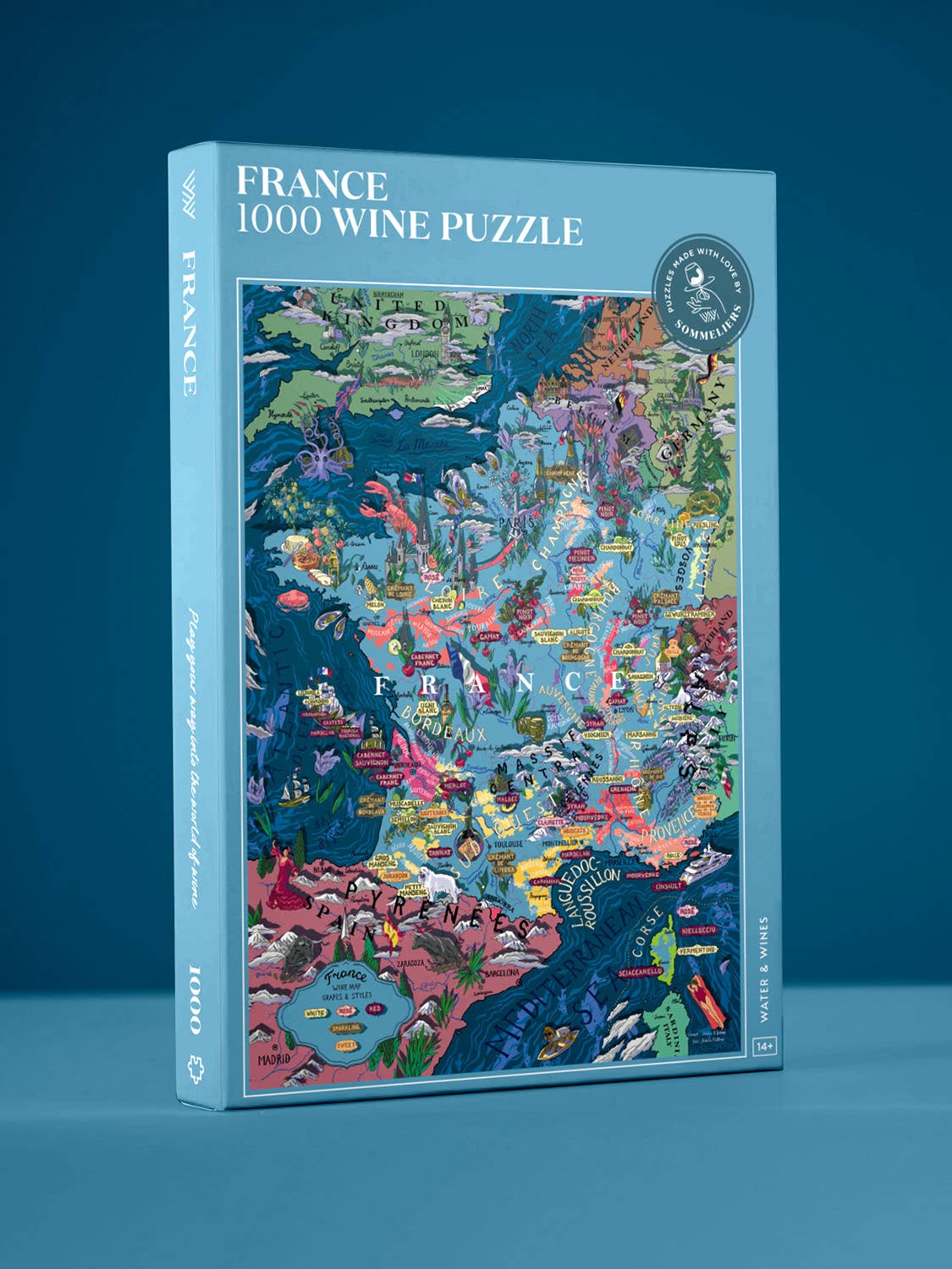 Die farbenfrohe Schachtel des Water & Wines - Wein Puzzle - Frankreich (1000 Teile) steht aufrecht vor einem blauen Hintergrund und zeigt eine lebendig illustrierte Karte der französischen Weinregionen sowie den Markennamen Water & Wines auf dem Deckel.