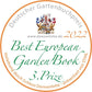 Kreisförmige Plakette für den 3. Preis für das beste europäische Gartenbuch 2022, mit Wappen und deutschem Text, der auf "Royale Gärten" vom Prestel Verlag für einen herausragenden Bildband über Schlossgärten verweist.