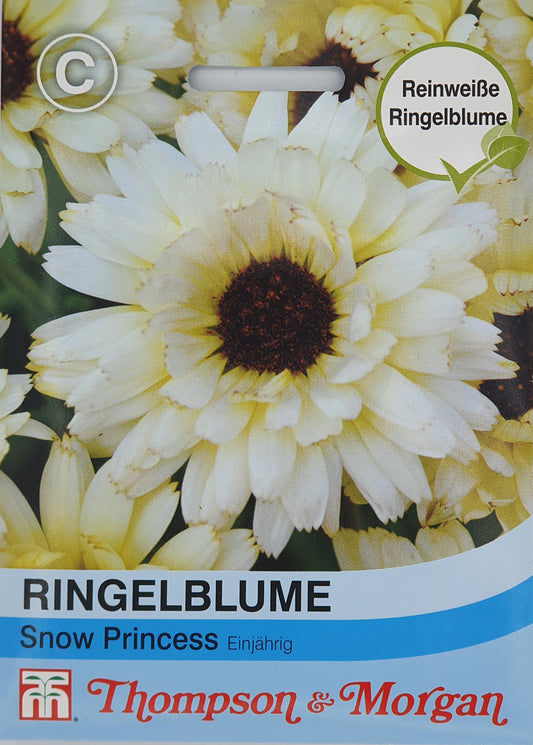 Ringelblume Snow Princess Saatgut von Thompson und Morgan: Nahaufnahme weißer Sommerblumen mit dunkler Mitte. Die Verpackung enthält deutschen Text und ein rundes Etikett mit „Reinweiße Ringelblume“.